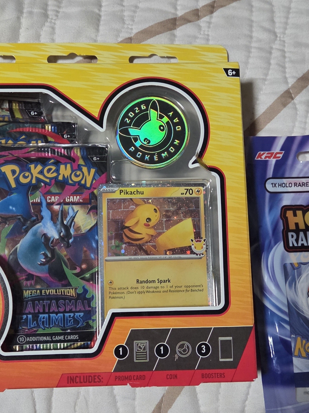 bundled up Pokémon Pikachu Promo Card & Coin Set